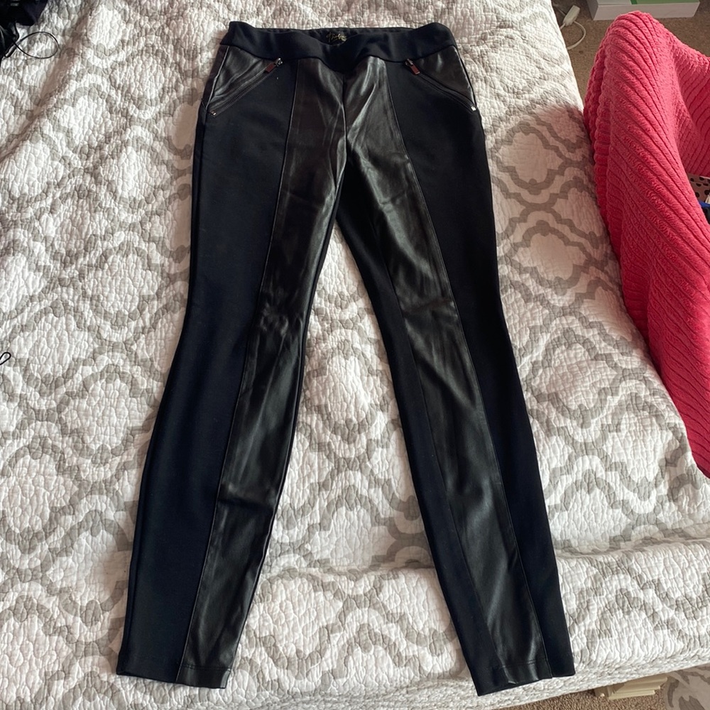 Black leggings with leather in the front.